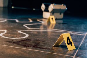 chalk outline at the murder scene with evidence markers