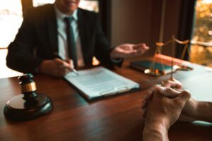 Client meets with lawyer to review legal documents and discuss case strategy.