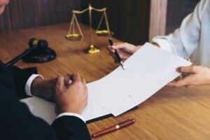 A lawyer reviewing a contract with a client.