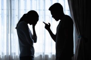 a husband shouting at a crying wife