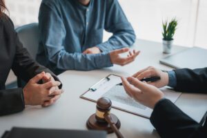 a lawyer talking to two people