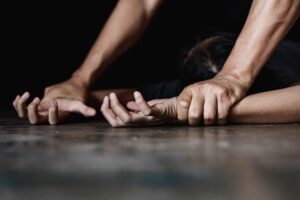 a man attempting to rape a woman