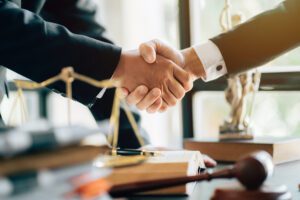 a man shaking hands with a lawyer