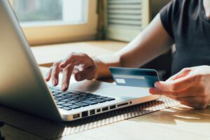a woman purchasing online using a credit card