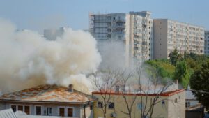 A building surrounded by smoke.