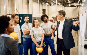 Construction workers talking to a lawyer.
